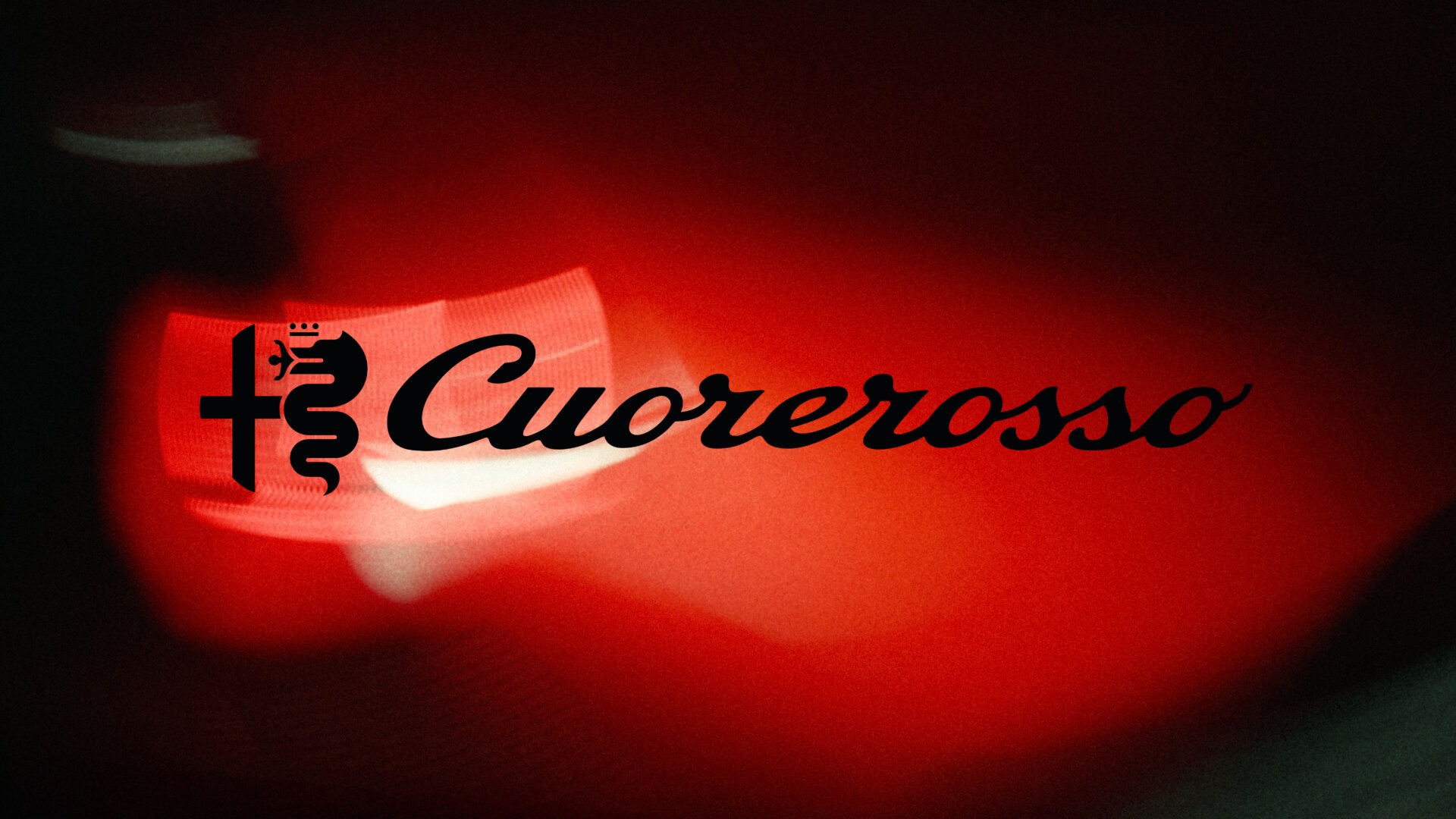 Teaser mit dem Schriftzug Alfa Romeo Cuorerosso auf rotem Grund